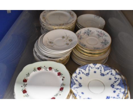 A selection of ceramic tea cup saucers and cake plates