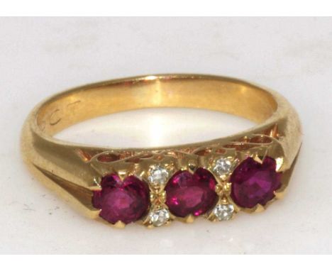 Ruby & diamond gold ring set in 9ct yellow gold, with the rubies(approx 0.6ct) with 4 small diamonds. Size 3 / G. Total weigh