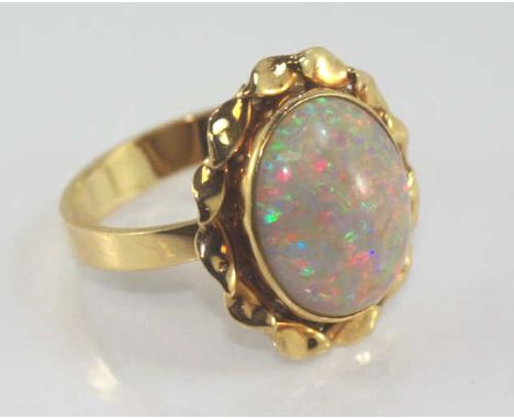 Good 9ct yellow gold and solid white opal ring weight: approx 4.3 grams, size: approx O1/2 / 7