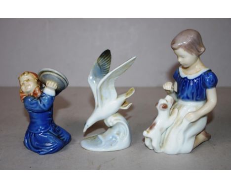 Three ceramic figurines including  Bing & Grondahl 'girl with puppy' , 13cm high approx (tallest)