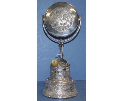 Vintage American silver plate shaving stand including mirror, shaving mug and brushes etc, on stand with embossed decoration.