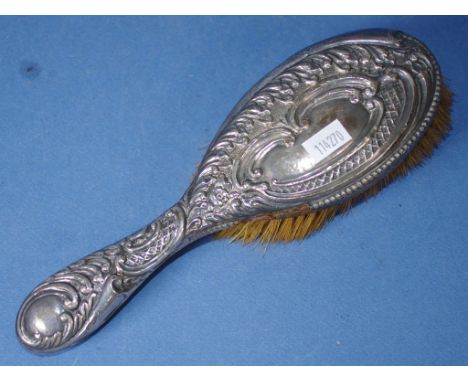 Vintage silver backed hairbrush embossed decoration. (As inspected: loss of silver to 1 side).