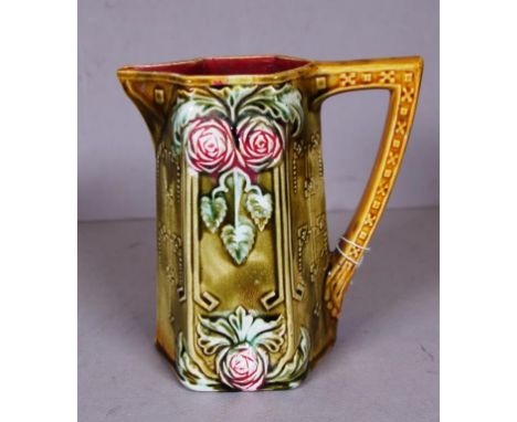 Vintage French majolica ceramic milk jug marked to base 'Frie Onnaing,' embossed floral decoration. Height 15cm approx.
