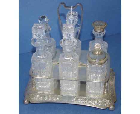 Vintage silver plate & crystal condiment cruet with 6 crystal bottles (1 with replaced stopper), 2with silver plate lids, on 