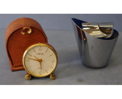 Vintage Looping 15 jewel lever travel clock in a leather case, together with a Ronson retro desk lighter