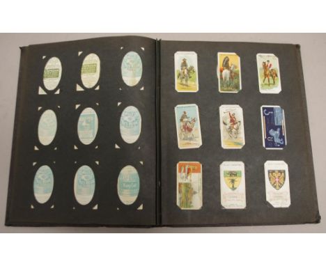 Vintage album of cigarette cards including early Wills, birds, racehorses, sportsmen etc. Approximately 150 cards in total. C