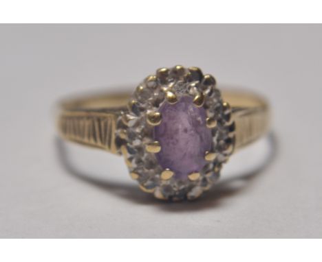 9ct gold amethyst set dress ring. Weighs 1.5g