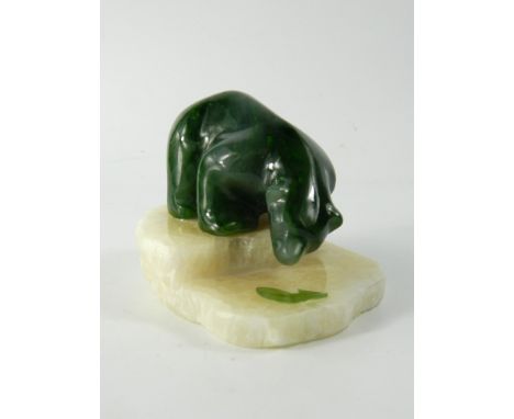 Canadian Jade Polar Bear model, the carved model hunting a fish on polished stone base, Q9216, etched to base