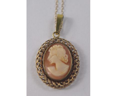 Vintage yellow metal set oval cameo pendant on a 9ct chain