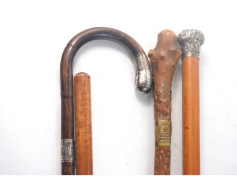 Three vintage silver topped/badged walking sticks with a Captain Watt of Innerleithen WWI swagger stick