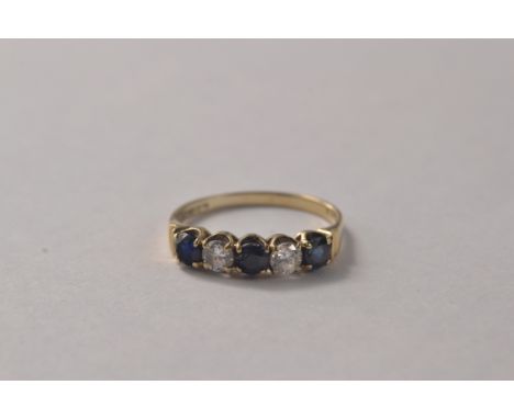 London hallmarked 9ct yellow gold ring set with 3 saphires and 2 white stones [size O] 1.9grm gross