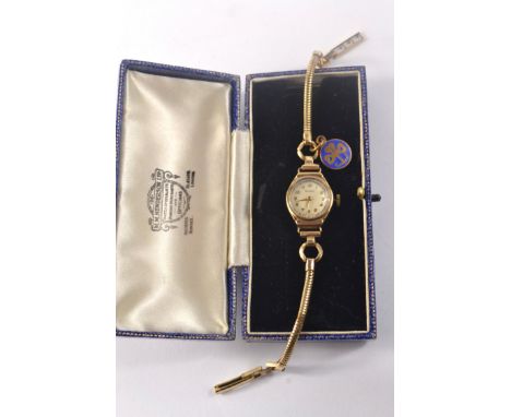 9ct Gold cased 'Rotary' ladies wrist watch, with rolled gold strap. stamped '375' hallmarked. 
