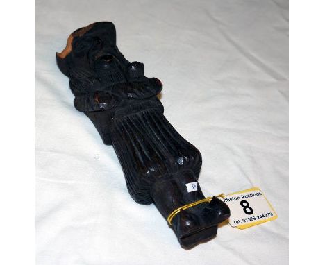 Early carved wooden nut cracker of primitive American man