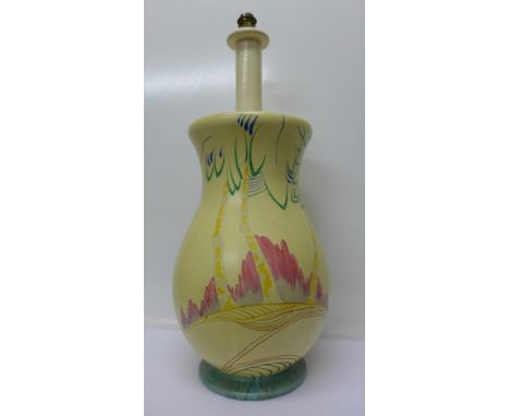 A large Clarice Cliff table lamp base with paper label to base in the hand of Clarice Cliff, 'In Place of Meadowfields, Silve