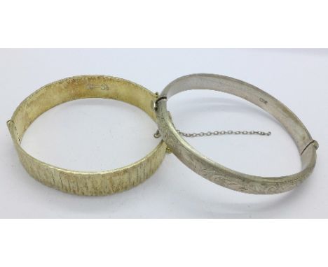 A 22ct gold on silver bangle and one other silver bangle, 45g