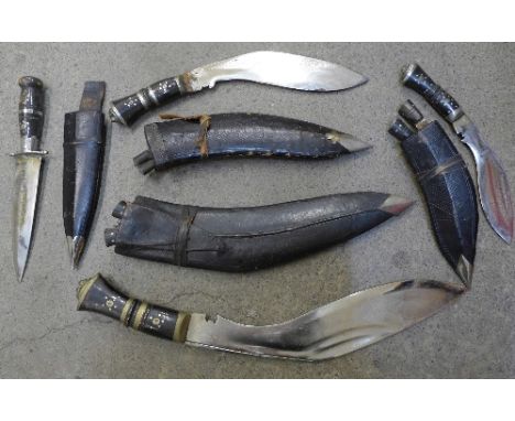Three kukri with scabbards and a dagger with scabbard