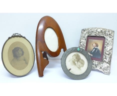 Four photograph frames including pewter set with ceramic plaque