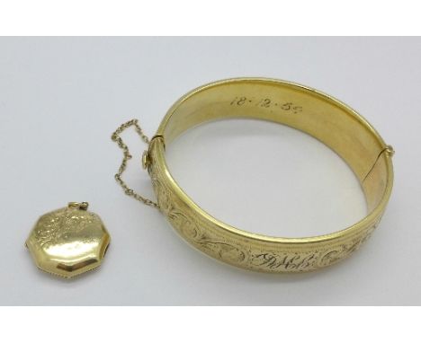 A rolled gold bangle and a 9ct gold back and front locket