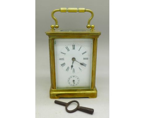 A brass carriage clock, height of case 103mm, front and side glass a/f