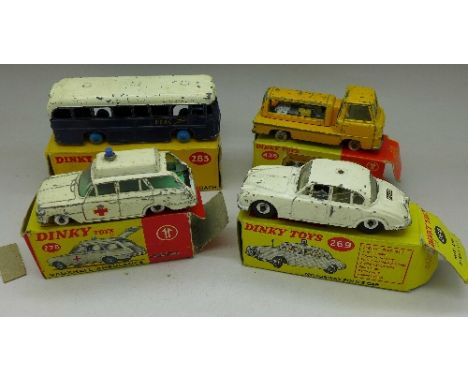 Four Dinky Toys; 278 Vauxhall Ambulance, 269 Motorway Police Car (3.4 Jaguar), 283 B.O.A.C. Coach, lacking tyres and 436 Atla