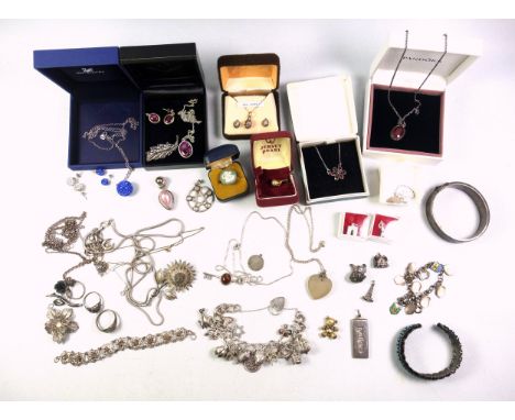 Silver hinged bracelet, 28.6 grams, silver ingot, 27.6 grams, silver charm bracelet holding 15 charms, 62.6 grams, 800 standa