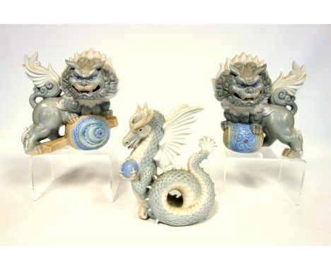 Yoshimi K, a pair of porcelain foo dogs, w15cm x h16cm, and a dragon. (3) 