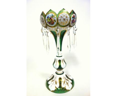 Bohemian green glass table lustre, scalloped upper rim, cut with panels enamelled with alternate polychrome flowers and gilt 