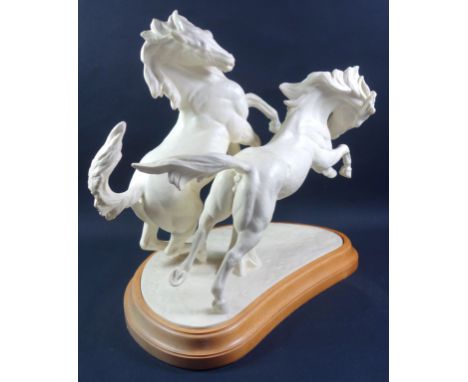 Royal Worcester group, "Galloping Horses", modelled by Doris Lindner, No.3466, printed gold mark, with a wooden plinth, 40.5 