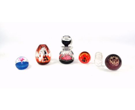 Caithness cut glass perfume bottle, the body with ovolo decoration and containing a rose within a border of smaller flowers, 