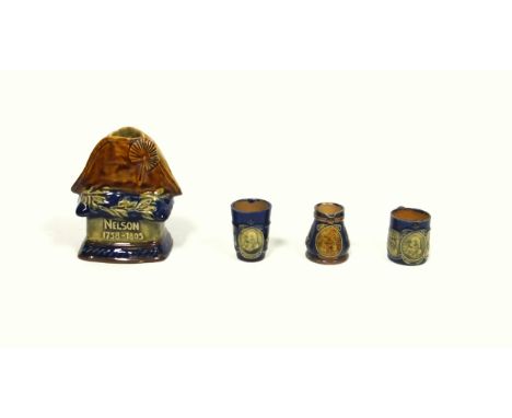 Royal Doulton stoneware commemorative candle holder, modelled as a bicorn hat with rosette on a pedestal base inscribed "Nels