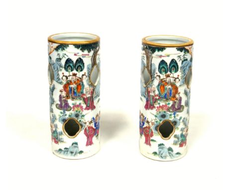 Pair of Late 19th Century Chinese, Qing Dynasty, porcelain cylindrical hat stands, each decorated in polychrome enamels with 