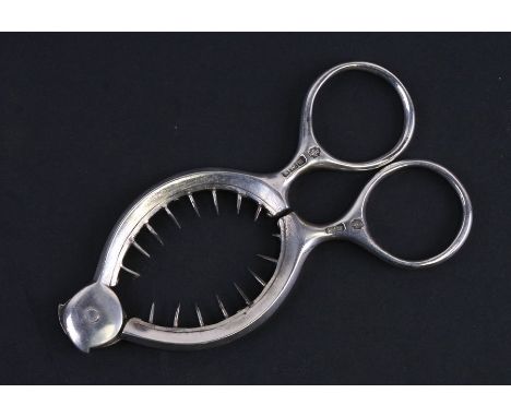 A silver egg topper with circular loop handles, Sheffield 1904.Condition ReportOne pin has snapped off and not present, clear