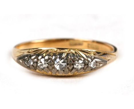 An 18ct gold five-stone diamond ring, approx UK size 'L'.Condition Reporthallmarked, shank a little worn, diamonds illusion s