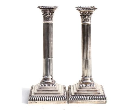 A pair of Victorian silver Corinthian column candlesticks on square stepped bases, Sheffield 1901, 28cms (11ins) high.Conditi