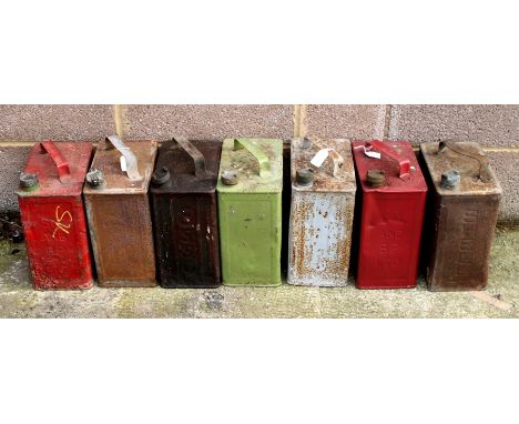 Seven two-gallon petrol cans, all with brass caps, SM and BP Ltd x 2, MOTOT BP SPIRIT, ESSO, PRATTS, SHELL and RED LION.Condi