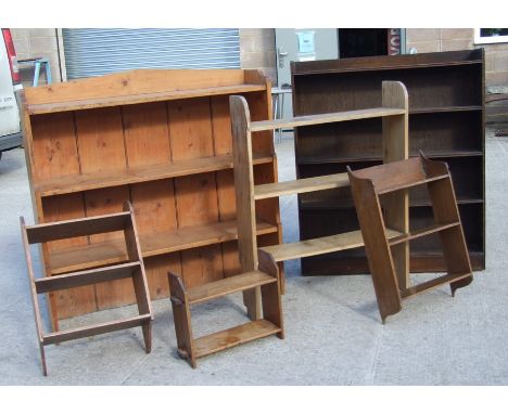 A pine three tier open book shelf, 108cms (42ins) wide; together with another similar, 76cms (30ins) wide; and other shelving