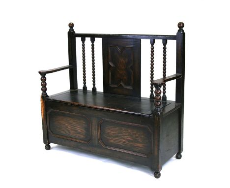 An oak hall bench with bobbin turning, 107cms (42ins) wide.Condition Report100cm high&nbsp; 40cm deep.&nbsp; no worm.&nbsp; &