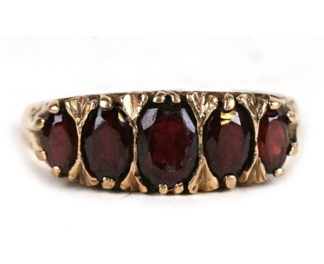 A 9ct gold five-stone garnet ring., approx UK size 'R'.