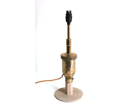 A polished brass table lamp made from a rear axle differential, 42cms (16.5ins) high.