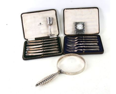 Six silver handled cake forks, Sheffield 1925; together with a similar set of silver handled picnic knives; a Middle Eastern 