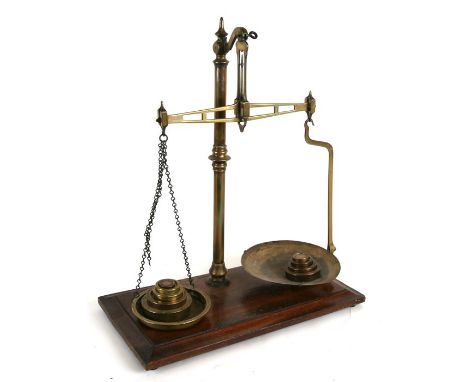 An Avery Ltd brass and mahogany set of beam scales & weights.Condition ReportOne chain broken.