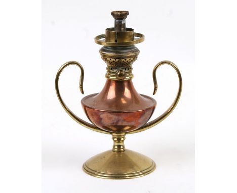 An Arts &amp; Crafts WAS Benson brass and copper oil lamp with scroll handles, 19cms (7.5ins) high.