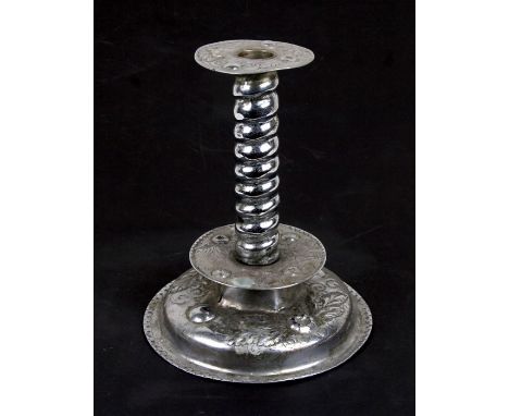 An Arts &amp; Crafts style chrome plated candlestick, 24cms (9.5ins) high.