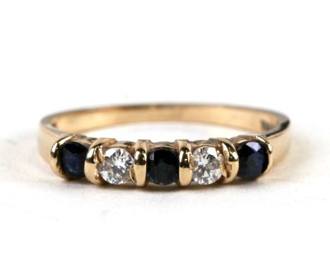 A 9ct gold dress ring set with three sapphires and two cubic zirconia, weight 1.5g, approx UK size 'L'.