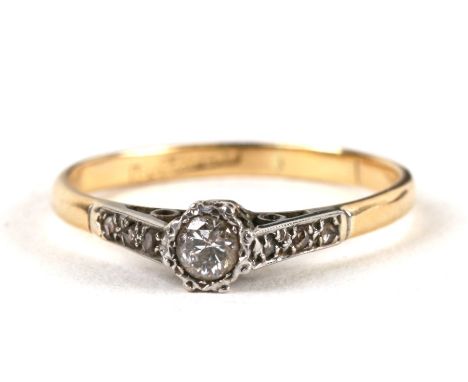 An 18ct gold &amp; platinum diamond solitaire ring, weight 2.2g, approx UK size 'P'.