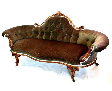 A Victorian mahogany framed button back sofa, approx 72ins wide.