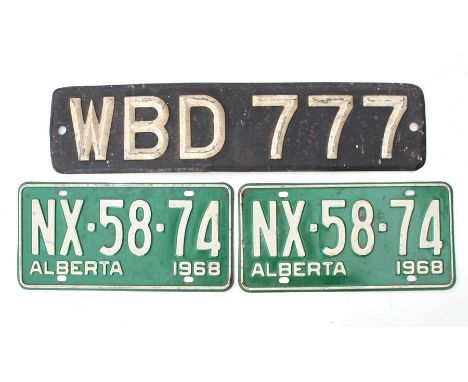 A pair of vintage Canadian number plates, Alberta 1968, and 1950's British front number plate WBD 777, for display purposes o