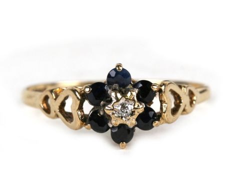 A 9ct gold diamond and sapphire flower ring, approx UK size 'S'.