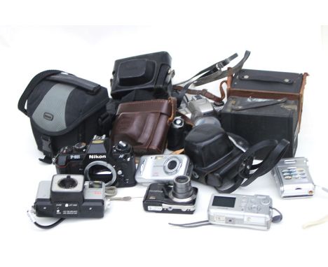 A Nikon f-501 camera; together with other cameras and camera equipment.