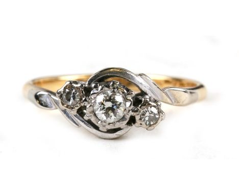 An 18ct gold and platinum three-stone diamond ring, approx UK size 'K'.Condition Reporthallmarked. shank has slight wear. no 